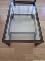 Full view of coffee table showing glass top and frame