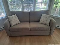 Front view of loveseat with two pillows