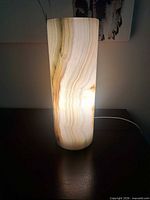 Lamp illuminated showing onyx banding and cord