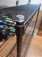 Corner post showing wire shelf attachment and threaded top cap