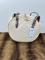 Front view showing straw spiral design, tags attached