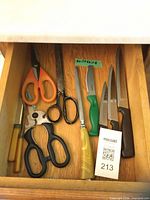 Drawer with assorted scissors, shears, kitchen knives including Wiltshire knife