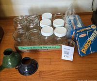 Full lot showing jars with plastic lids in tray, Parowax box, bagged wax, two enamel funnels