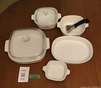 Full set showing all CorningWare pieces, lid and spatula