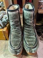 Front view of both boots showing faux fur uppers and overall style