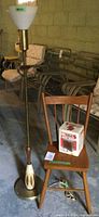 Lamp, chair and boxed heater grouped together