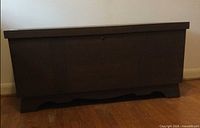 Front view of dark brown cedar blanket chest