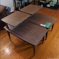 Both tiered side tables angled view showing design and finish