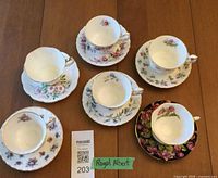 Six Royal Albert teacup and saucer sets displayed
