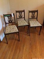 Front view of all three Duncan Phyfe style dining chairs
