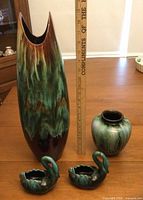 Full set with ruler showing large vase, medium vase, pair of swan planters