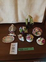 Group shot of all nine porcelain items on tabletop