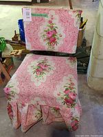 Front view of slipper chair with pink floral upholstery