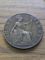 Reverse of 1910 bronze halfpenny showing Britannia, denomination and date