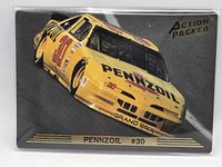 Front of embossed Action Packed card showing yellow #30 Pennzoil Pontiac Grand Prix stock car