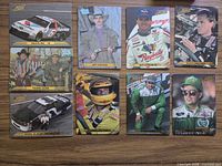 Nine cards laid out showing variety of drivers and themed cards