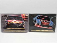 Front view of both trading cards in sleeves