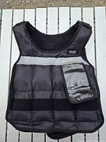 Front view showing pockets, reflective band, clear phone pocket