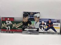 Front view of three hockey cards: Zach Parise Canvas, Sidney Crosby Mirror, Connor McDavid
