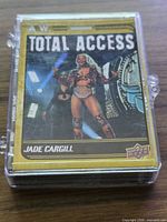 Cards in protective hard case with Jade Cargill Total Access on front