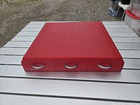Top view of closed red three-drawer organizer