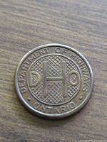 Obverse showing D H O monogram and Ontario Department of Highways legend