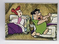Front view of the Return of The Flintstones card #27 depicting Fred and Wilma Flintstone in bed scene, card in sleeve