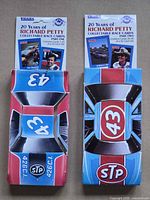 Front view of both Part One and Part Two boxes showing graphics and titles