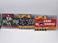 Front view of all three cards in holders: Parise, Tarasenko, Toews
