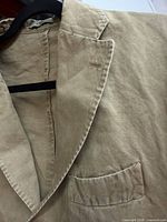 Close-up of lapel, fabric texture, front chest pocket
