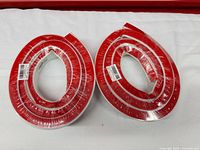 Two sealed rolls foam weatherstripping with red release liner