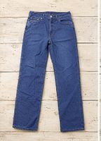 Full view of blue straight leg pants laid flat