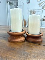 Both flameless candles side by side showing size difference and wood bases