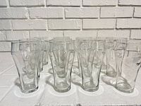 Front view of grouped Coca-Cola glasses