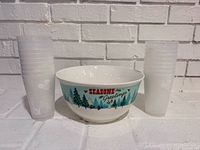 Bowl centered between stacked cups showing overall lot