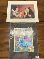 Both signed Disney photo prints together