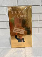 Front view of sealed Trumped Up Cards gold box