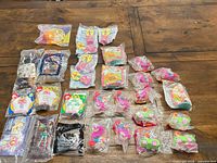 All 29 sealed toys laid out on table