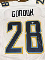 Full back view showing number 28, autograph, COA sticker