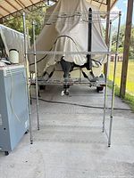 Front view of five-shelf chrome wire rack