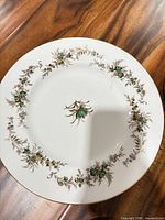 Dinner plate showing Greenbrier pattern and gold rim