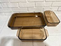 Top view of all three amber glass dishes showing size and shape