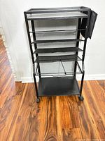 Full front view showing overall structure, shelves, casters