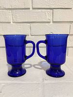 both cobalt blue pedestal cups front view