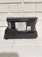 Battery in side profile seated in dock