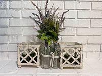 Front view showing both metal planters flanking the three glass vases with faux lavender