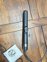 Full view of Visage cool air dual styler showing vented plates and attached cord