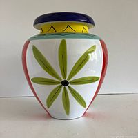 Front view showing green petal motif and multicolour bands