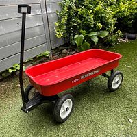 Full view of Eaton Roadking wagon showing red body, black handle, white wheels