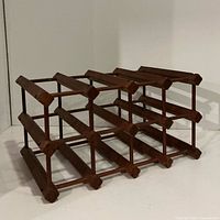 overall view of wooden lattice wine rack, angled front